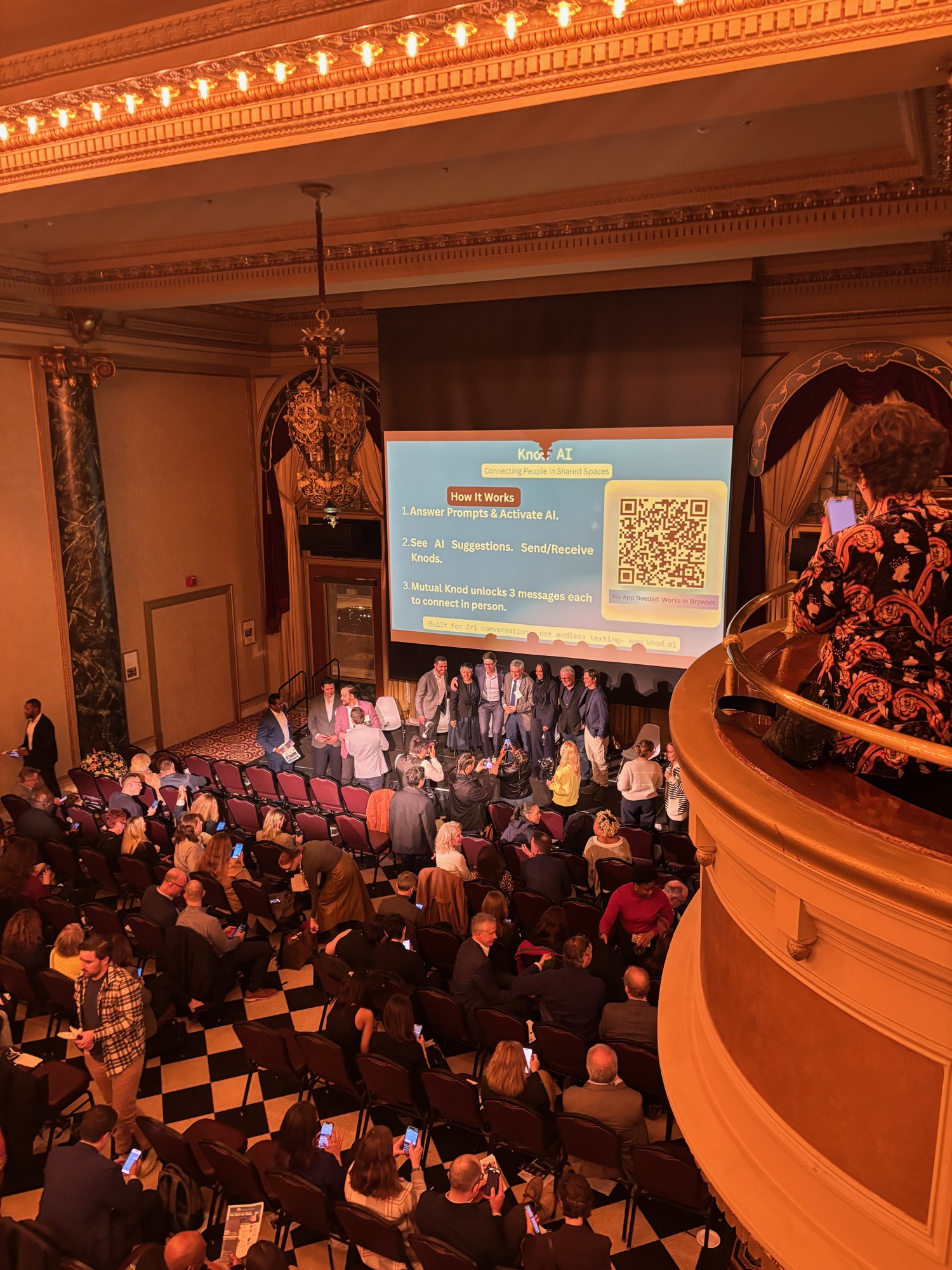 A full ballroom of Chicago Innovation attendees seen from the balcony